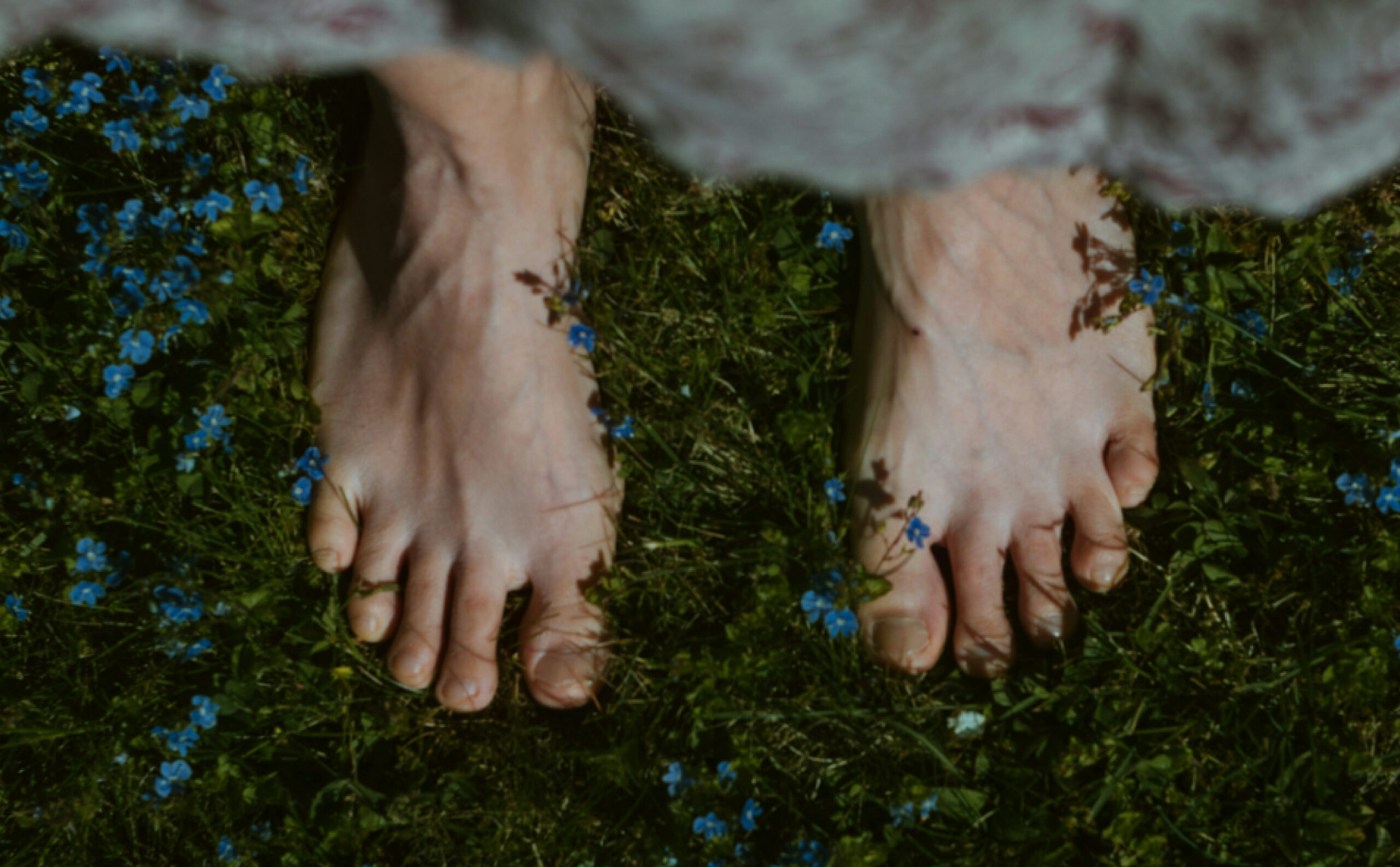 Natural beauty campaign Natural beauty campaign — barefoot on grass. Eden Root, where beauty blooms.